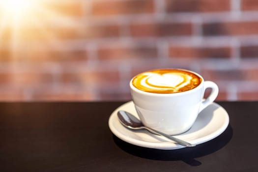 A cup of coffee on a with heart, valentines day, red wall, restaurant photo