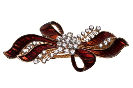 Close-up of a beautiful elegant luxurious hair clip or hair pin with rhinestones isolated on a white background. Macro photograph.
