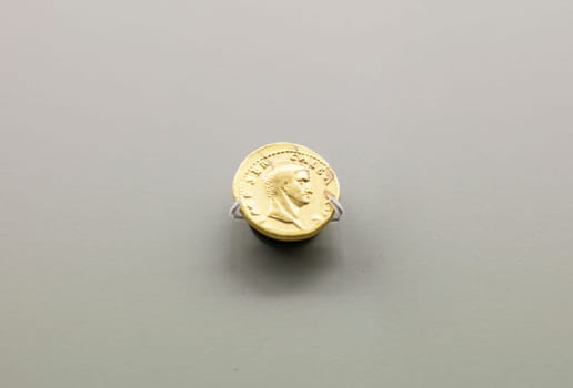 Merida, Spain - August 25th, 2018: Galba Roman emperor gold coin. National Museum of Roman Art in Merida, Spain