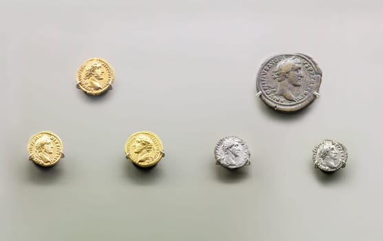 Merida, Spain - August 25th, 2018: Antoninus Pius Roman Emperor coins. National Museum of Roman Art in Merida, Spain. Isolated over white