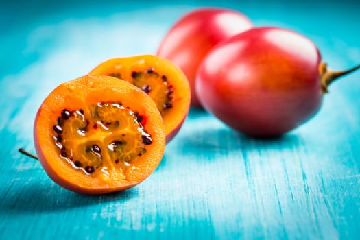 Fresh tamarillo fruit on wooden background