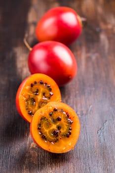 Fresh tamarillo fruit on wooden background