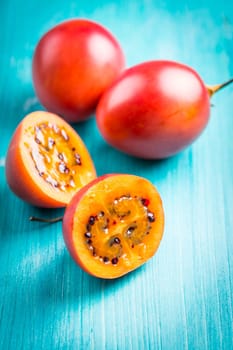 Fresh tamarillo fruit on wooden background