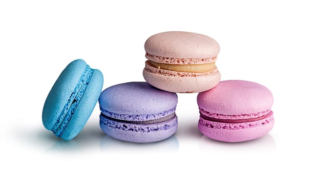 Three macaroon pyramid and one near on white background