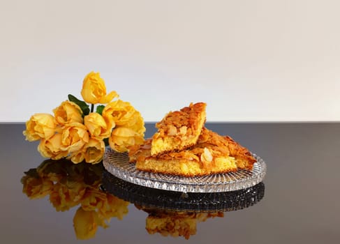 Appetizingly arranged trybake with almond crust and tulips.