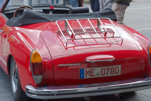HEILIGENHAUS, NRW, GERMANY - SEPTEMBER 10, 2017:.Heiligenhaus, Nrw, Germany - September 10, 2017:.Vintage Volkswagen Karmann Ghia car rear view in red, parked in Heiligenhaus, Germany.