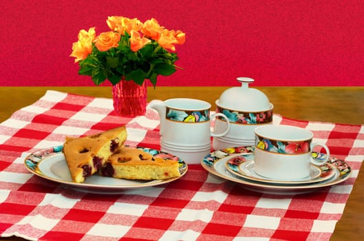 The coffee table is colourfully decorated with a bouquet of flowers.