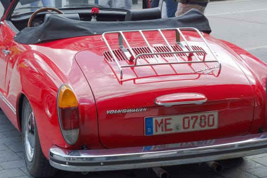 HEILIGENHAUS, NRW, GERMANY - SEPTEMBER 10, 2017:.Heiligenhaus, Nrw, Germany - September 10, 2017:.Vintage Volkswagen Karmann Ghia car rear view in red, parked in Heiligenhaus, Germany.