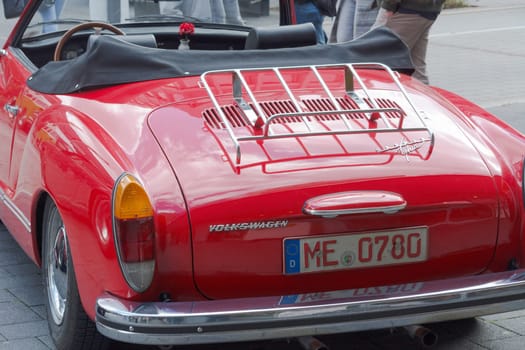 HEILIGENHAUS, NRW, GERMANY - SEPTEMBER 10, 2017:.Heiligenhaus, Nrw, Germany - September 10, 2017:.Vintage Volkswagen Karmann Ghia car rear view in red, parked in Heiligenhaus, Germany.