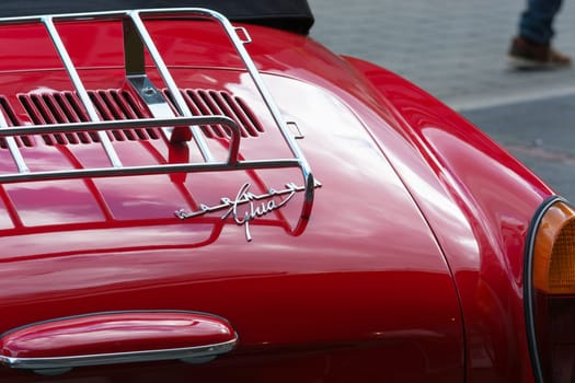 HEILIGENHAUS, NRW, GERMANY - SEPTEMBER 10, 2017:.Heiligenhaus, Nrw, Germany - September 10, 2017:.Vintage Volkswagen Karmann Ghia car rear view in red, parked in Heiligenhaus, Germany.