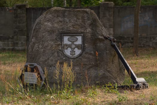ROSSLAU, GERMANY - AUGUST 05, 2018:.Rosslau, Germany - August 05, 2018:..Memorial Kaserne Roßlau. Memorial stone commemorating the sponsorship of the city of Roßlau to 1 Spez / Bi Btl 174