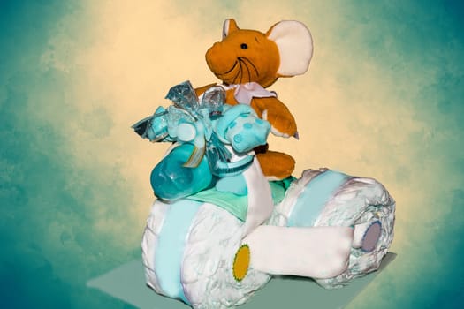 HEILIGENHAUS, NRW, GERMANY - JANUARY 21, 2019:.Heiligenhaus, Nrw, Germany - January 21, 2019:.Studio shot for editorial use. Diaper cake A diaper cake Tricycle with blue ribbons. Gift for the birth of a child
