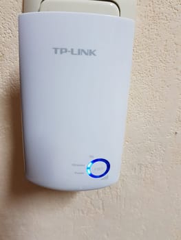 HEILIGENHAUS, NRW, GERMANY - DECEMBER 16, 2018: TP-Link TL-WA850RE WLAN Repeater with 300 Mbps, WLAN amplifier, App control, Ethernet port, WPS, AP mode, LED switchable, compatible with all WLAN devices in white
