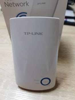 HEILIGENHAUS, NRW, GERMANY - DECEMBER 16, 2018: .Heiligenhaus, Nrw, Germany - December 16, 2018: .TP-Link TL-WA850RE WLAN Repeater with 300 Mbps, WLAN amplifier, App control, Ethernet port, WPS, AP mode, LED switchable, compatible with all WLAN devices in white