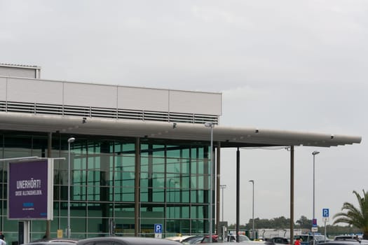 WEEZE, NRW, GERMANY - SEPTEMBER 10, 2018:.Entrance area of regional airport Weeze photographed from the parking lot