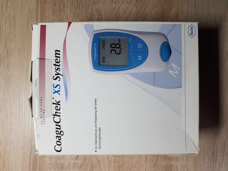 HEILIGENHAUS, NRW, GERMANY - NOVEMBER 30, 2018:.Heiligenhaus, Nrw, Germany - November 30, 2018:.Coagulation Self Management with the CoaguChek..Medical device for the determination and monitoring of blood clotting.