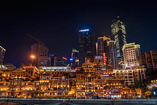 Chongqing, China -  August 2019 : Nightscape of brightly lit stunning Hongyadong Ancient Town