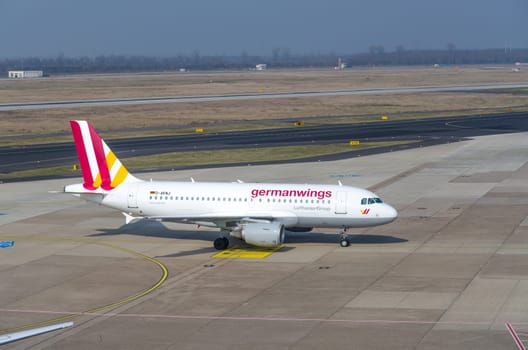 DUSSELDORF, NRW, GERMANY - MARCH 18, 2015:.Up, Airplane Dusseldorf. View of the tarmac. Large passenger airplane at the gate.