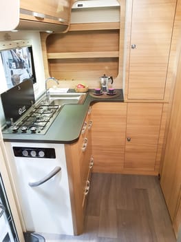 DUESSELDORF, NRW, GERMANY - AUGUST 29, 2018:.Vehicle interior view of a motorhome with a view of the kitchen on an Austelung. Concept freedom, family vacation trip, holiday trip with camper.