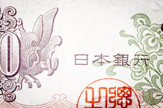 Into an old Japanese banknote. One hundred.