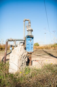 pipe connections in the countryside. Blue Cap