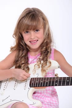 Little girl playing guitar