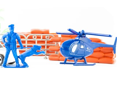 Little toys cop. Elicopter, policeman and policedog.
