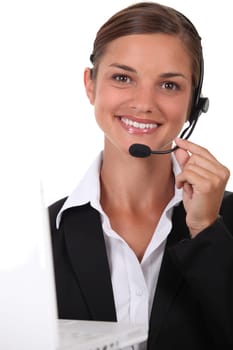 Receptionist with headset and computer