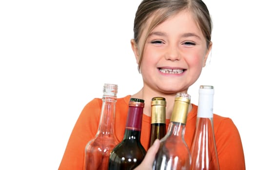 Little girl with empty bottles
