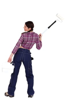 Back view of a decorator with a roller