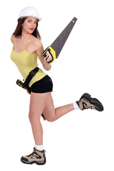 Attractive female builder with hand saw