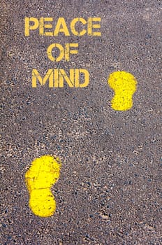 Yellow footsteps on sidewalk towards Peace of Mind message, Serenity conceptual image