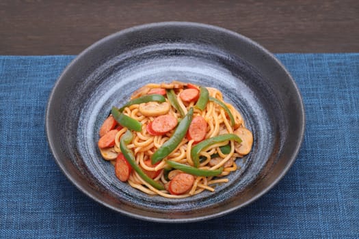 Japanese Naporitan spaghetti with tomato sauce in a dish on table