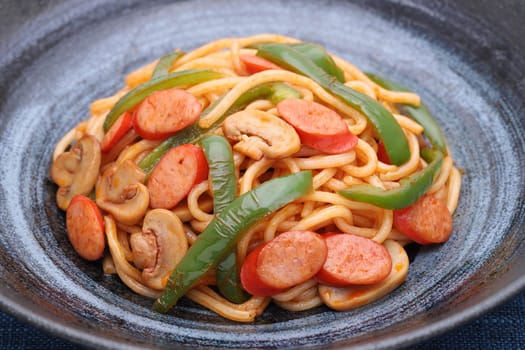 Close up of Japanese Naporitan spaghetti with tomato sauce in a dish