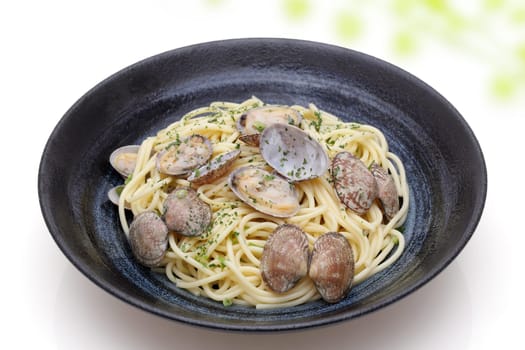 Vongole spaghetti in a dish on white background