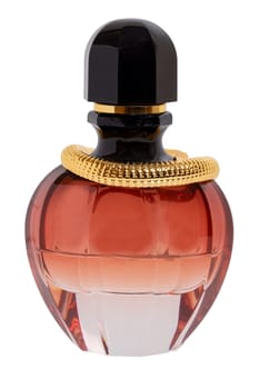 Luxurious perfume in beautiful glass bottle with gold decorations and black cap isolated on a white background. Space. Macro photograph.