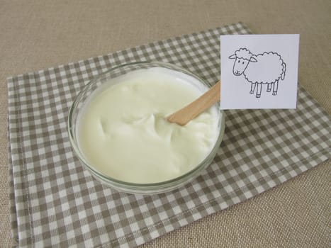 Fresh sheep quark, farmer cheese from the sheep in a glass bowl