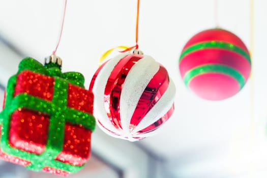 colorful ball and gift box mobile hanging on the ceiling