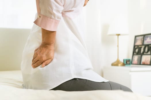 Back pain of old woman at home, healthcare problem of senior concept