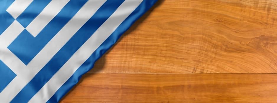 National flag of Greece on a wooden background with copy space