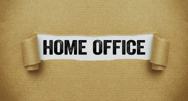 Torn paper revealing the words Home office