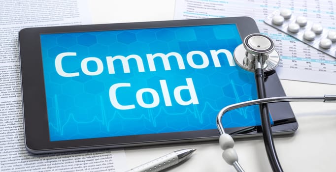 The word Common Cold on the display of a tablet