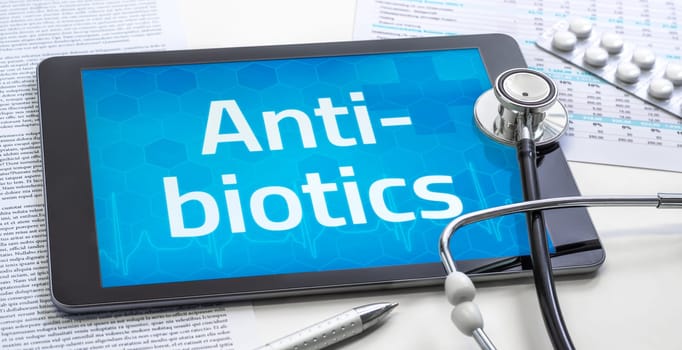 The word Antibiotics on the display of a tablet