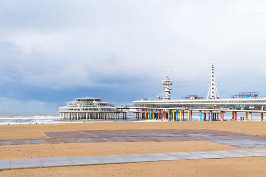 DEN HAAG, NETHERLANDS - OCTOBER 27, 2018: The famous Scheveningen Pier with ferris wheel and bungy jump tower