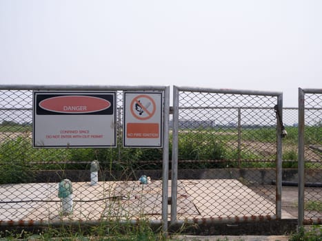 Restricted Area Sign on wire mesh fence