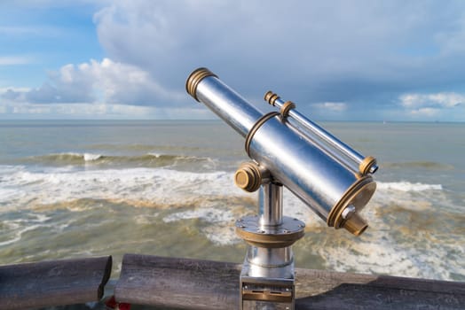 coin operated observation binocular at the Dutch north sea coast