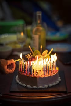 Birthday cake with candles in dark