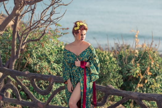 Portrait of a Japanese Geisha in kimono  at sunrise time near the sea