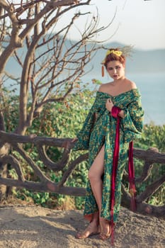 Portrait of a Japanese Geisha in kimono  at sunrise time near the sea