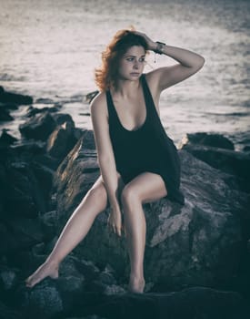 Portrait of a beautiful sexy woman outdoor. Model near the sea